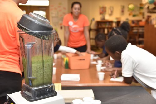 Children receive healthy eating and cooking education from Orlando Health staff at the Orange Center Elementary School in Florida. [Orlando Health]