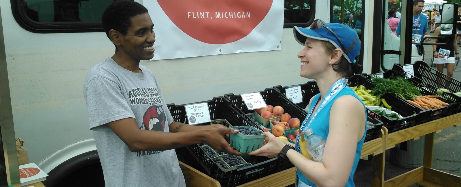 Flint Fresh Mobile Market, purchasing blue berries
