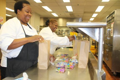 Staff at Our Lady of the Lake Regional Medical Center prepare lunch bags for the USDA Summer Food Service Program, which provides healthy meals to children to when school is out of session. Our Lady of the Lake sponsors a feeding site at their pediatric clinic.