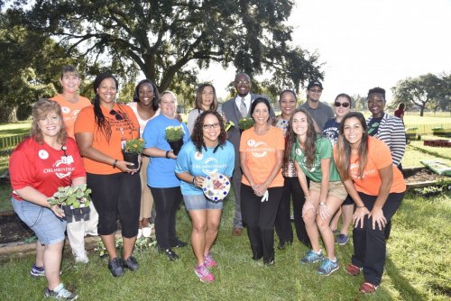 Orlando Health staff members volunteer at Orange Center Elementary School’s Healthy Living Garden  