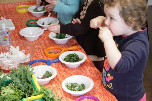 Children help the demonstrator during a Farm, Fresh, Fabulous cooking course [Family Cook Productions]